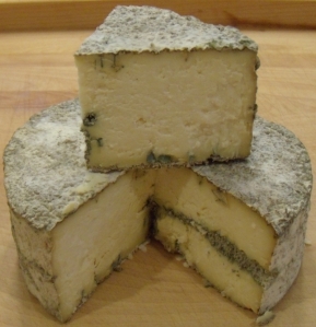 Blue cheese showing small amount of marbling.